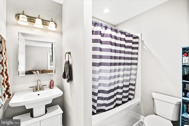 3048 Oakland Rd, Louisa, VA 23093 - bathroom featuring toilet, a sink, and shower / tub combo with curtain
