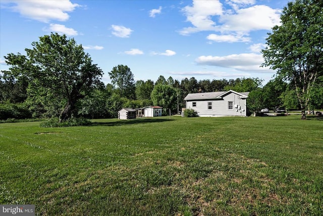 3048 Oakland Rd, Louisa, VA 23093 - view of green lawn with a storage unit and an outdoor structure