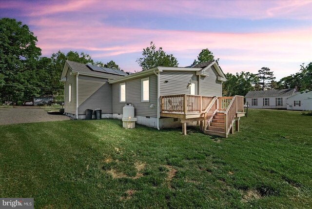 3048 Oakland Rd, Louisa, VA 23093 - back of house with a deck, solar panels, crawl space, and a lawn