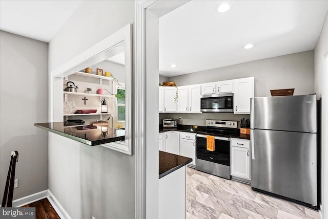 3048 Oakland Rd, Louisa, VA 23093 - kitchen with stainless steel appliances, white cabinets, recessed lighting, a peninsula, and open shelves