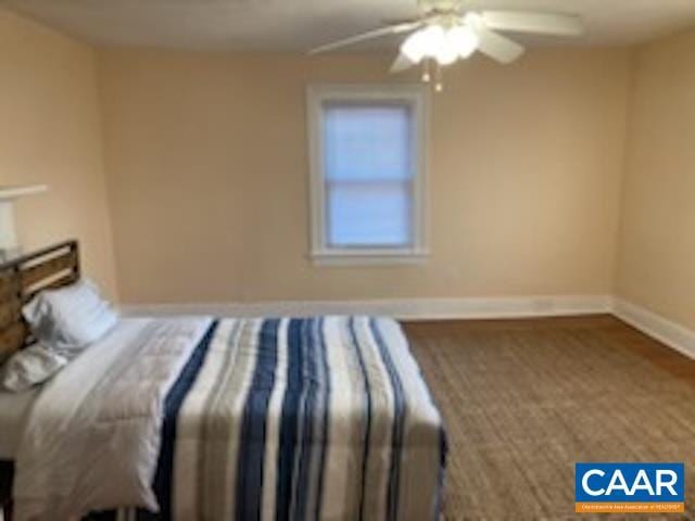 308 6th St SW, Charlottesville, VA 22903 - unfurnished bedroom with baseboards and a ceiling fan