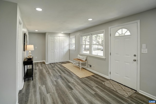 entrance foyer featuring wood finished floors, baseboards, and recessed lighting