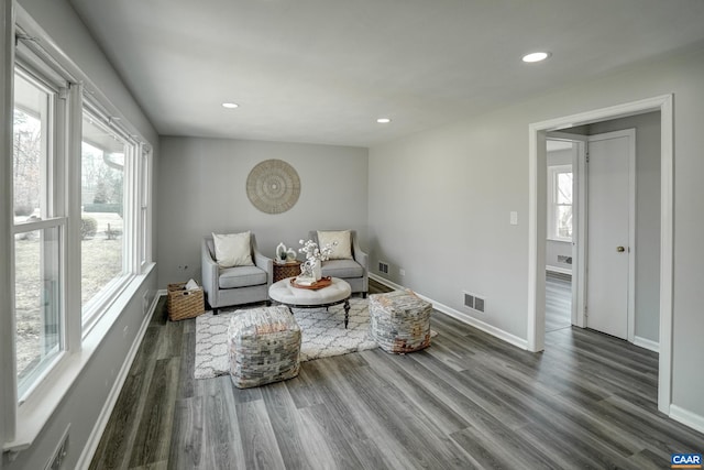 sitting room with wood finished floors, recessed lighting, and baseboards