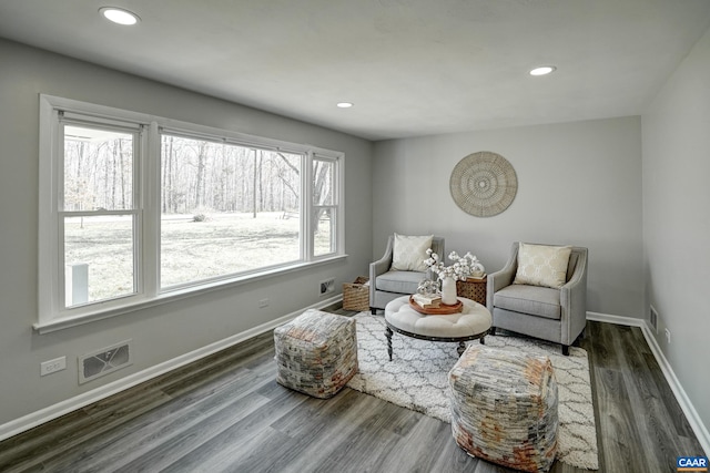 sitting room featuring wood finished floors, baseboards, and recessed lighting
