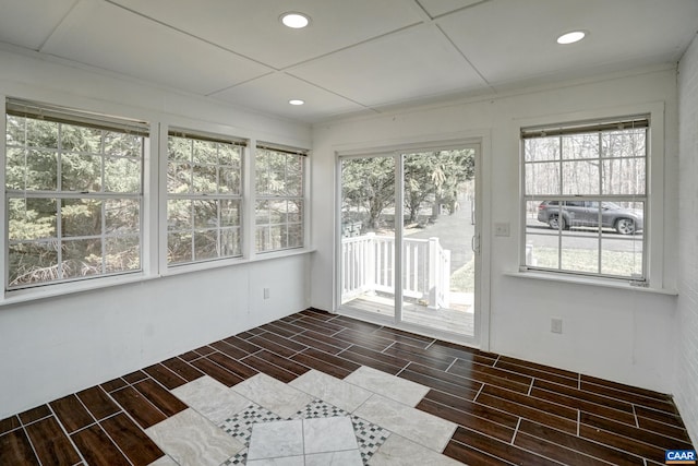 unfurnished sunroom with plenty of natural light