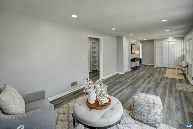 living room with recessed lighting, wood finished floors, and baseboards