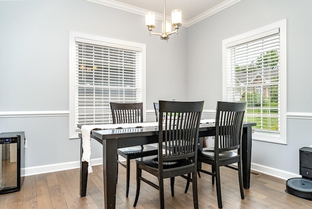 4517 Wiltshire St, Rockingham, VA 22802 - dining room with ornamental molding, a chandelier, wood finished floors, and healthy amount of natural light