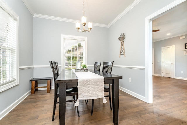 4517 Wiltshire St, Rockingham, VA 22802 - dining area with crown molding, wood finished floors, a chandelier, and baseboards