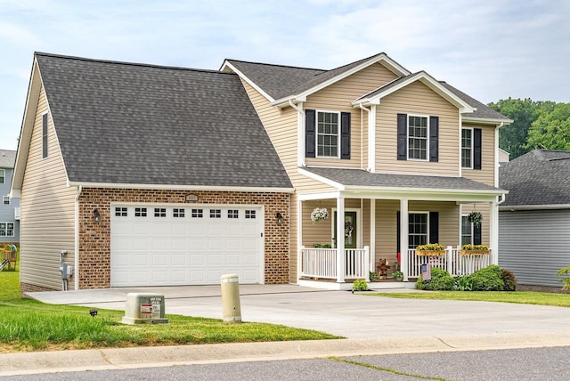 4517 Wiltshire St, Rockingham, VA 22802 - traditional home with covered porch, driveway, a garage, and roof with shingles