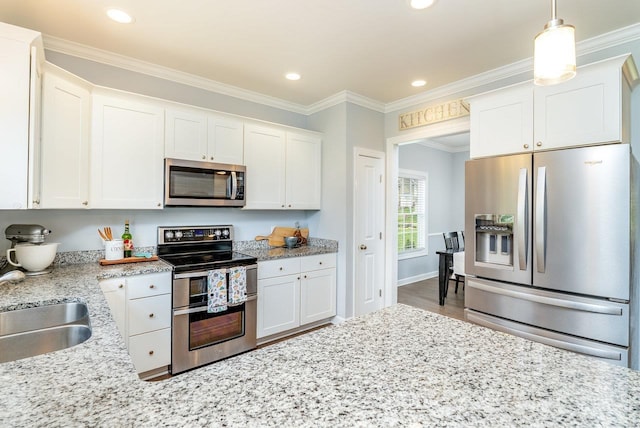 4517 Wiltshire St, Rockingham, VA 22802 - kitchen with appliances with stainless steel finishes, white cabinets, crown molding, wood finished floors, and recessed lighting