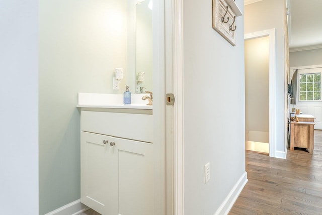 4517 Wiltshire St, Rockingham, VA 22802 - bathroom with vanity, wood finished floors, baseboards, and ornamental molding