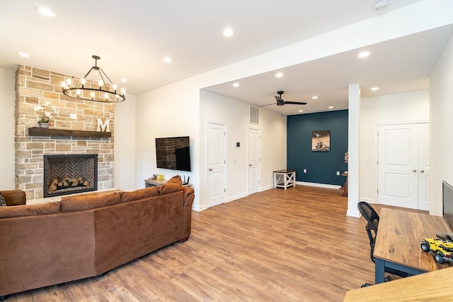 4517 Wiltshire St, Rockingham, VA 22802 - living room with light wood-style floors, recessed lighting, a chandelier, baseboards, and a fireplace