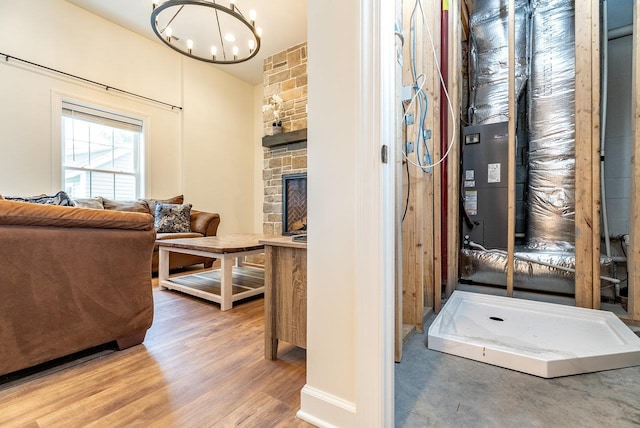 4517 Wiltshire St, Rockingham, VA 22802 - bathroom with a chandelier, wood finished floors, and a fireplace