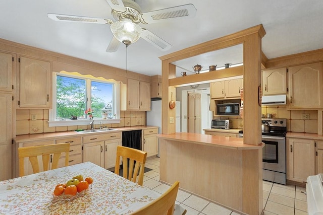 121 Central St S, Broadway, VA 22815 - kitchen with black microwave, ventilation hood, a sink, light brown cabinets, and light countertops