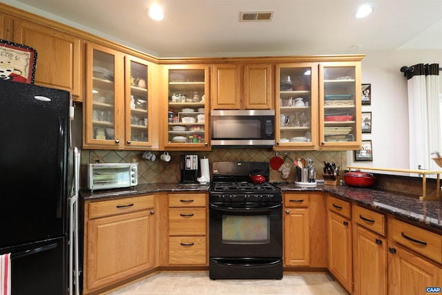 515 Broadleaf Way, Charlottesville, VA 22911 - kitchen with black appliances, tasteful backsplash, dark stone counters, glass insert cabinets, and recessed lighting