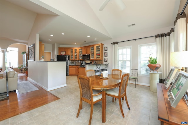 515 Broadleaf Way, Charlottesville, VA 22911 - dining space featuring vaulted ceiling, arched walkways, recessed lighting, ceiling fan, and light tile patterned floors