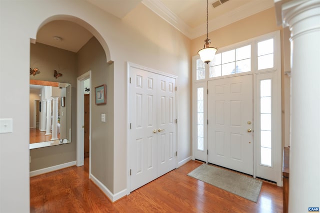 515 Broadleaf Way, Charlottesville, VA 22911 - foyer with arched walkways, healthy amount of natural light, ornamental molding, wood finished floors, and a towering ceiling