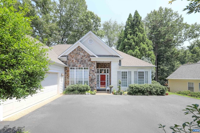 515 Broadleaf Way, Charlottesville, VA 22911 - view of front facade featuring asphalt driveway, stone siding, a garage, and roof with shingles