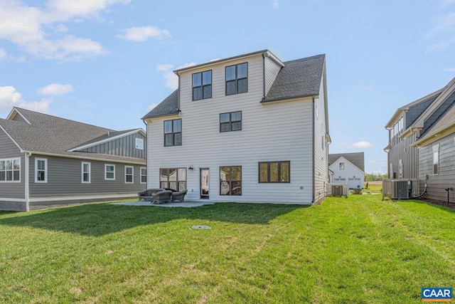 33 Fowler St Unit C, Charlottesville, VA 22911 - back of property with a patio area, a lawn, and central AC