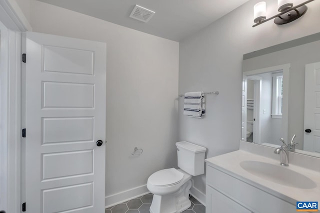 33 Fowler St Unit C, Charlottesville, VA 22911 - half bathroom featuring toilet, tile patterned flooring, baseboards, and vanity