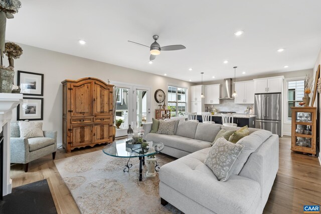 6211 Raynor Pl, Crozet, VA 22932 - living area featuring a ceiling fan, a fireplace, light wood-style flooring, recessed lighting, and french doors