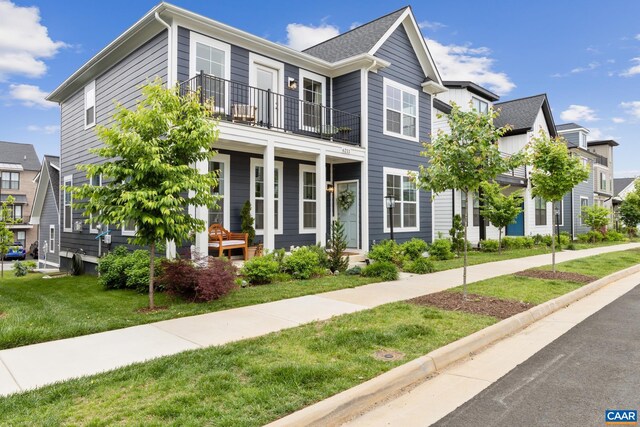 6211 Raynor Pl, Crozet, VA 22932 - townhome / multi-family property with a balcony, covered porch, and a front yard