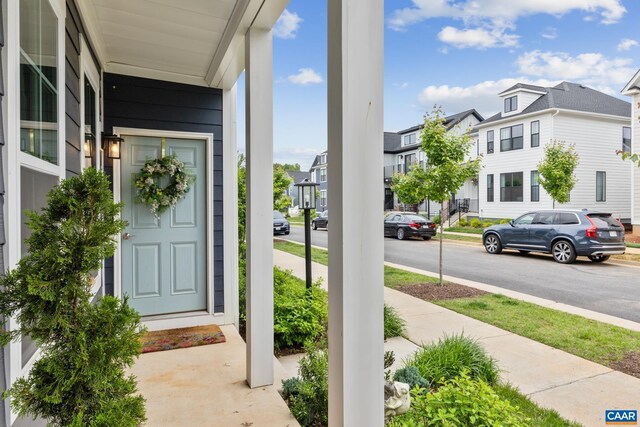 6211 Raynor Pl, Crozet, VA 22932 - view of exterior entry featuring a residential view and a porch