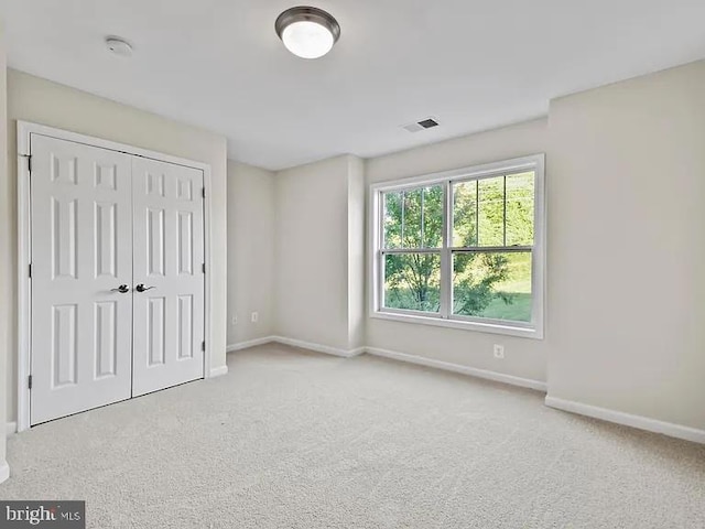 2486 Winthrop Dr, Charlottesville, VA 22911 - unfurnished bedroom featuring carpet, baseboards, and a closet