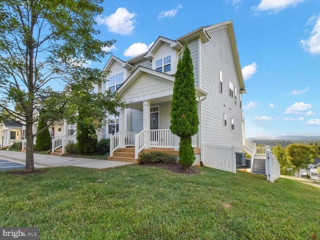 2486 Winthrop Dr, Charlottesville, VA 22911 - view of front of house with covered porch, stairs, a front yard, and central air condition unit