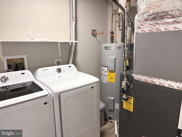 1625 Harrier Ln, Culpeper, VA 22701 - laundry area featuring washer and clothes dryer, electric water heater, wood finished floors, and heating unit
