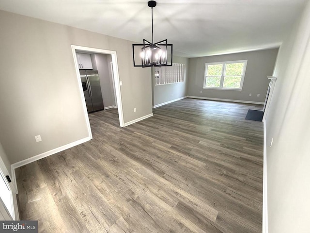 1625 Harrier Ln, Culpeper, VA 22701 - unfurnished dining area with dark wood-type flooring and a chandelier