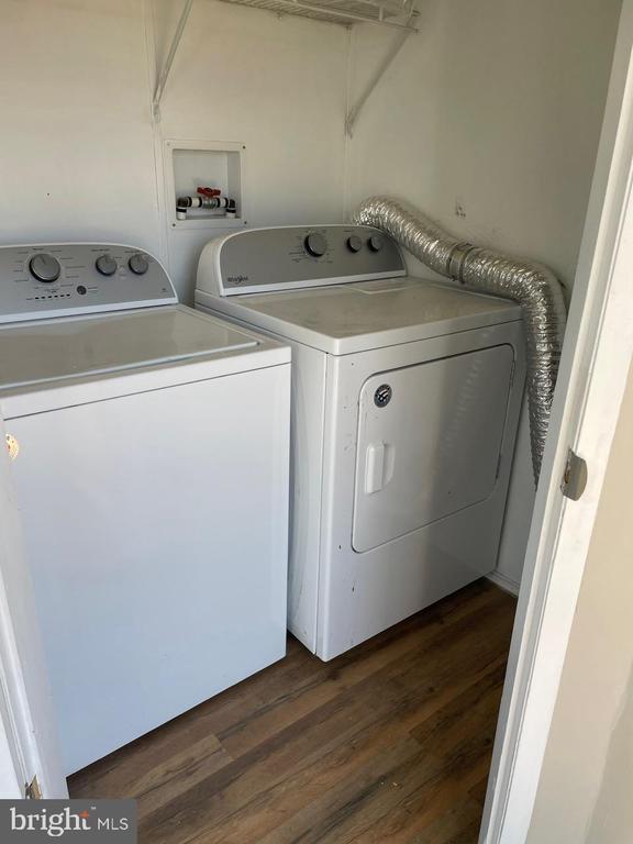 18393 Gaskins Ln, Jeffersonton, VA 22724 - washroom with dark wood-style flooring, laundry area, and washing machine and dryer