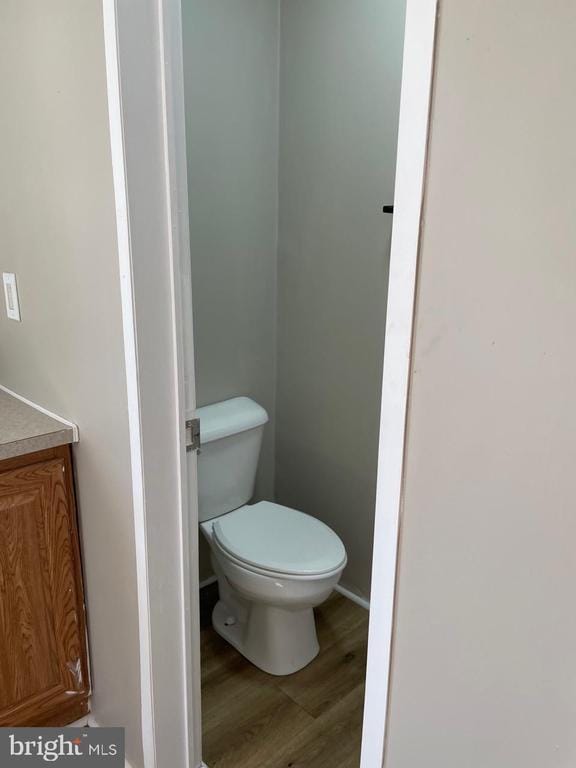 18393 Gaskins Ln, Jeffersonton, VA 22724 - bathroom featuring toilet, vanity, and wood finished floors