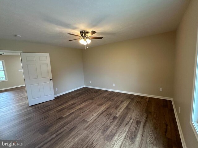 218 Honeyville Rd, Stanley, VA 22851 - spare room with a ceiling fan, dark wood-type flooring, and baseboards