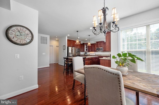 11407 Osprey Trl, Spotsylvania, VA 22551 - dining area featuring a notable chandelier, recessed lighting, baseboards, dark wood-style flooring, and visible vents