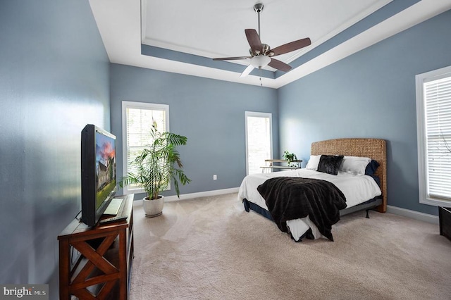 11407 Osprey Trl, Spotsylvania, VA 22551 - carpeted bedroom featuring baseboards, a tray ceiling, and ceiling fan