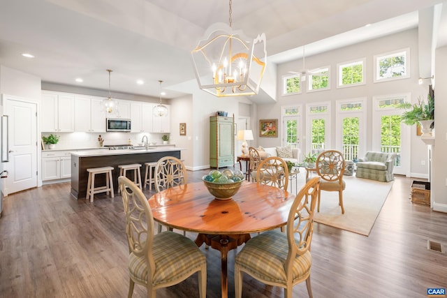 312 Avondale Ln, Crozet, VA 22932 - dining space featuring recessed lighting, dark wood-type flooring, a chandelier, ceiling fan, and a towering ceiling