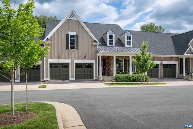 312 Avondale Ln, Crozet, VA 22932 - view of front of property with a standing seam roof, driveway, stone siding, and board and batten siding