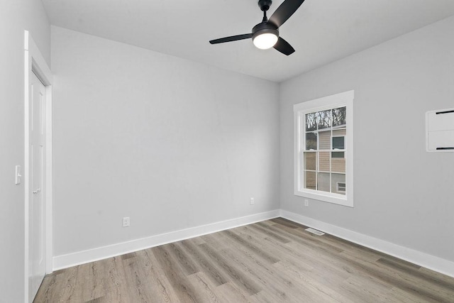 spare room with ceiling fan and light hardwood / wood-style flooring