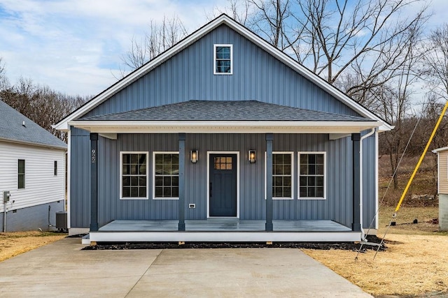 view of front of property featuring central AC unit and covered porch