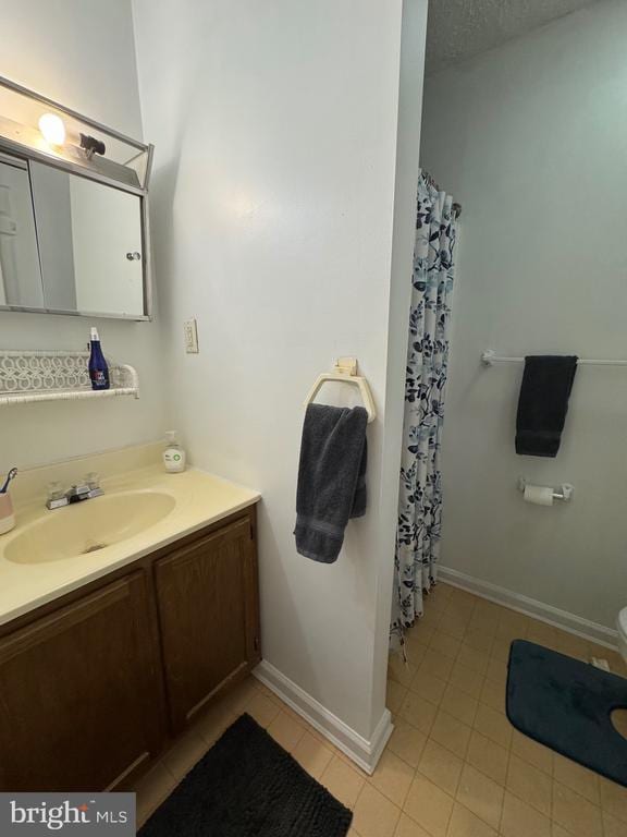 588 Meadowbrook Dr, Culpeper, VA 22701 - full bathroom with vanity, tile patterned floors, and curtained shower