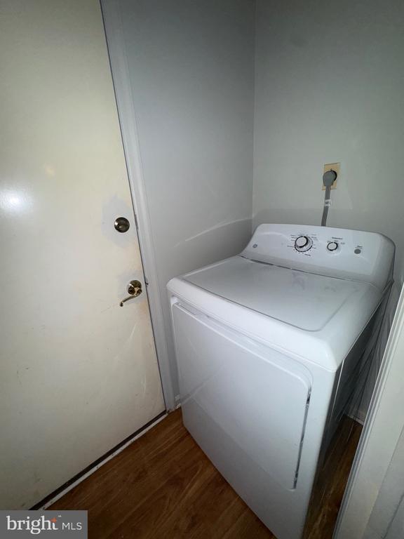 588 Meadowbrook Dr, Culpeper, VA 22701 - laundry area with washer / clothes dryer and wood finished floors