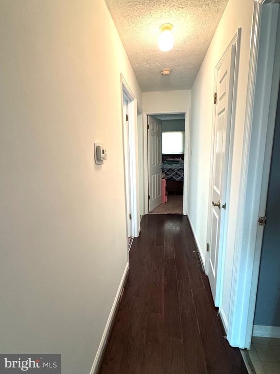 588 Meadowbrook Dr, Culpeper, VA 22701 - hallway with a textured ceiling and dark wood-type flooring
