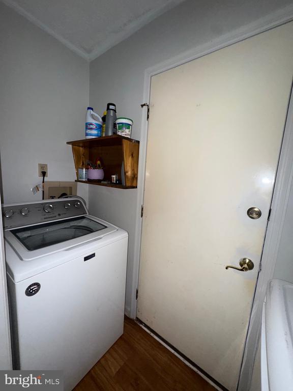588 Meadowbrook Dr, Culpeper, VA 22701 - laundry room featuring washer / dryer, wood finished floors, and crown molding