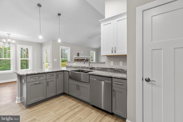 9712 Sutter Rd, Partlow, VA 22534 - kitchen featuring stainless steel dishwasher, a sink, gray cabinets, a peninsula, and light wood-type flooring