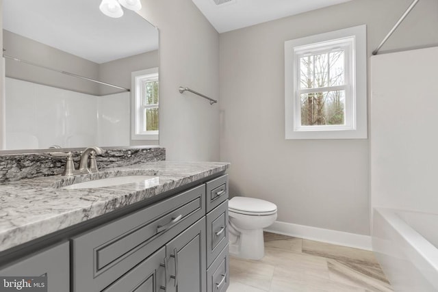 9712 Sutter Rd, Partlow, VA 22534 - bathroom featuring toilet, vanity, marble finish floors, baseboards, and shower / bath combination