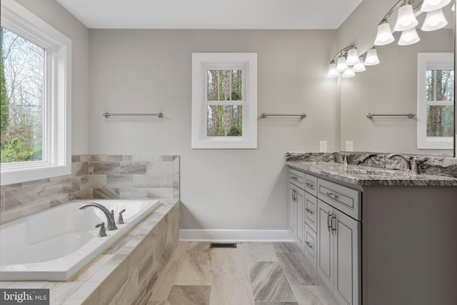 9712 Sutter Rd, Partlow, VA 22534 - full bathroom featuring vanity, a bath, healthy amount of natural light, and baseboards