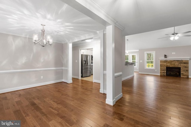 9712 Sutter Rd, Partlow, VA 22534 - unfurnished living room featuring a ceiling fan, dark wood-style floors, a chandelier, ornamental molding, and baseboards