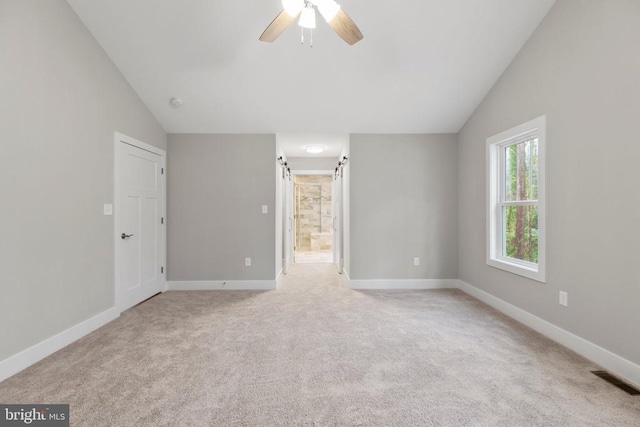 9712 Sutter Rd, Partlow, VA 22534 - unfurnished room featuring lofted ceiling, ceiling fan, light colored carpet, and baseboards