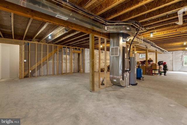 9712 Sutter Rd, Partlow, VA 22534 - basement with electric water heater and heating unit